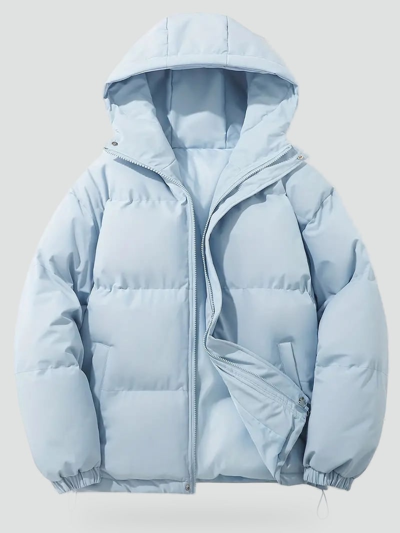 Hellblaue Pufferjacke liegend mit geöffnetem Reißverschluss